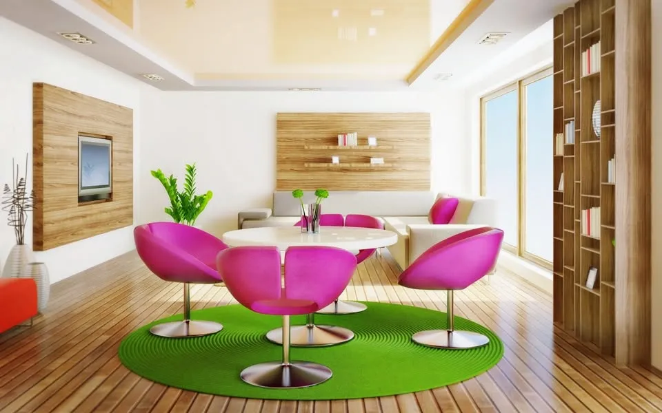 Colourful modern interior with pink chairs and a green rug, from our Facebook page