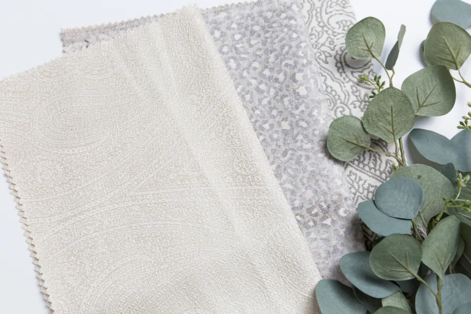 Linen fabric swatches laid out for a design consultation