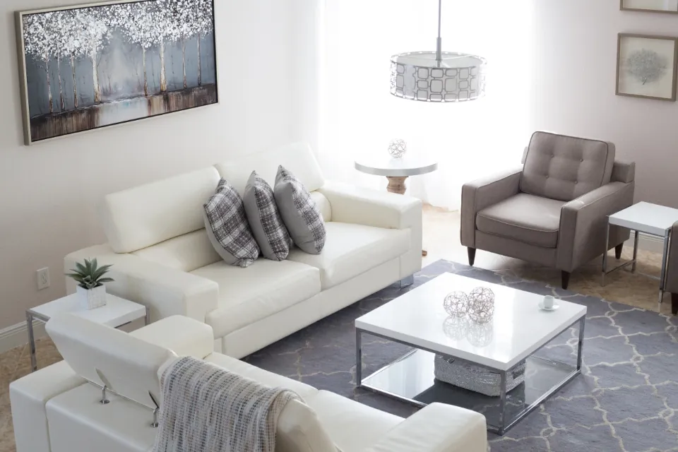 Living room with daylight streaming through a large window